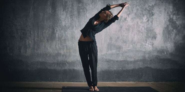 woman in yoga standing side bend