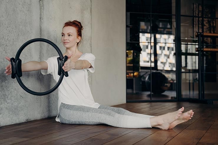 woman using a pilates ring