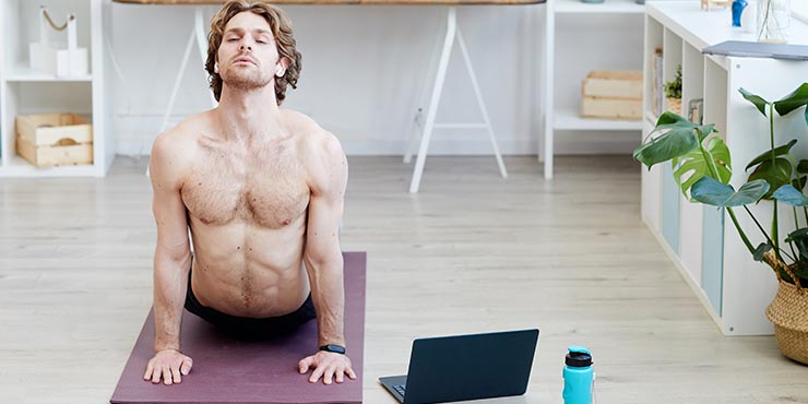 man doing yoga online