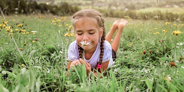 girl practicing mindfulness breathing outdoors