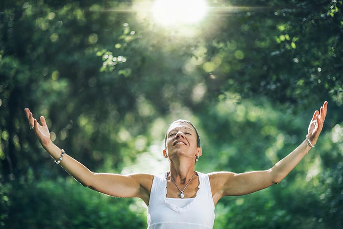 woman experiencing mindfulness in nature