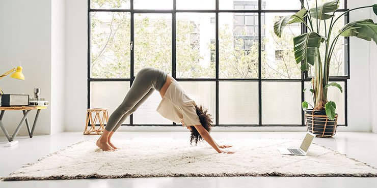 woman performing Adho Mukha Svanasana, downward facing dog
