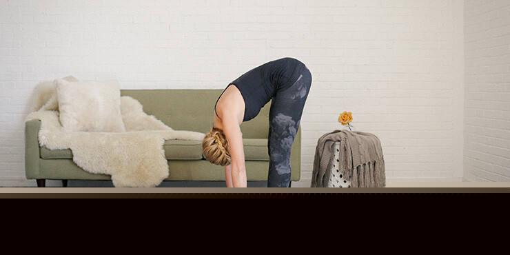 female performing Padangusthasana